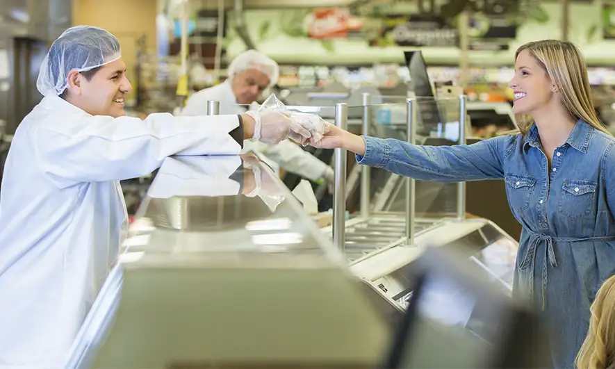 business owner works after getting sandwich shop insurance quote
