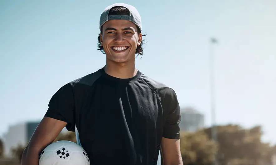 business owner happy after getting sport insurance quote