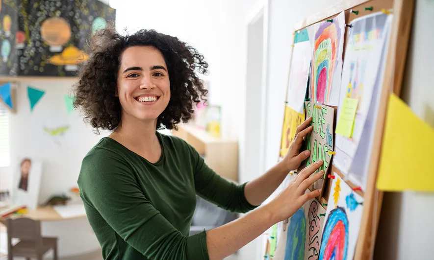 small business owner is happy after getting a Teacher Insurance quote from The Hartford