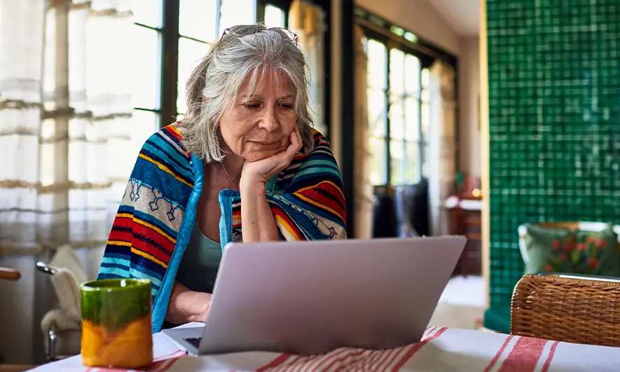 auto owner researching totaled car online