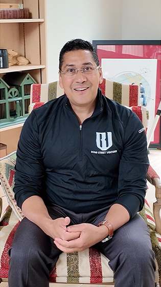 small business owner giving testimonial on having web developer insurance from The Hartford