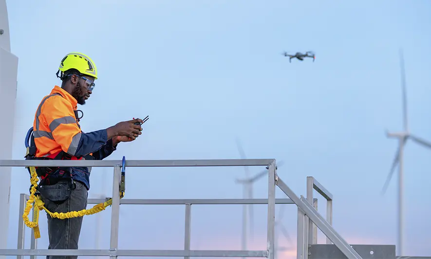 a man operating a drone for work outside